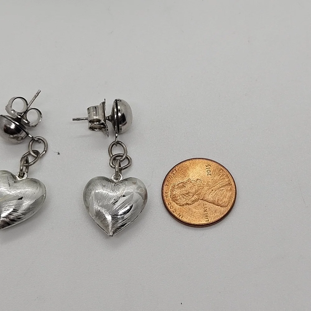 brushed silver tone heart dangle earrings